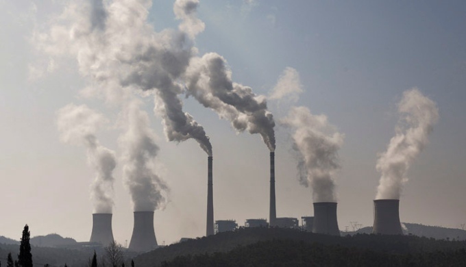 A potential shift in China’s position toward emission caps will be tectonic. Picture shows the chimneys from a coal-burning power station in China. (Image by Mingjia Zhou)