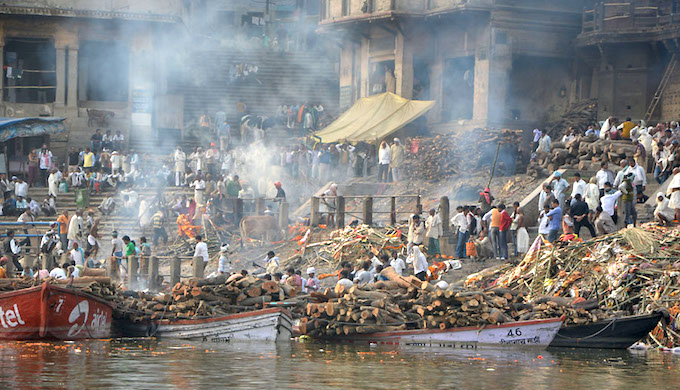 The Manikarnika Ghat cremation ground on the banks of the Ganga River in Varanasi. (Photo by Oliver Laumann)