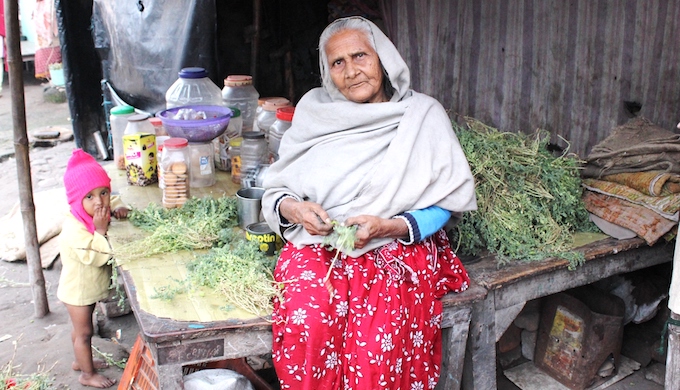 75-year-old Afsa Begum sells biscuits and fryums for kids who come to study in the madrasa housed in a crumbling 15th century mosque complex on the outskirts of Patna, Bihar, where she, her daughter-in-law and two-year-old granddaughter have squatted since years. Her husband is dead and her son left for Mangalore to work for a construction contractor after the severe monsoon floods in 2016. He has sent money only once. (Photo by Manipadma Jena)
