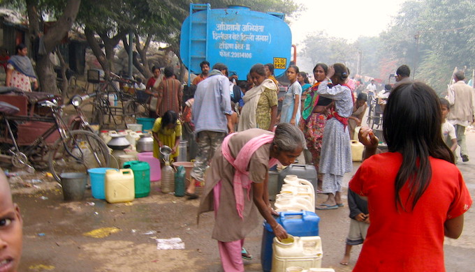 People collecting drinking water from a truck in India. (Photo by Jankie)