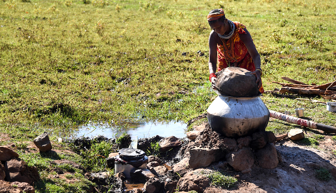 A Bonda woman preparing liquor from millets at Bonda hill (Photo by Tanmoy Bhaduri)