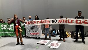Climate activists, who say carbon markets encourage developed countries to pollute, demonstrating at the Madrid climate summit (Photo by Joydeep Gupta)